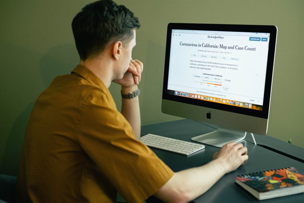 Man reading the news on the internet